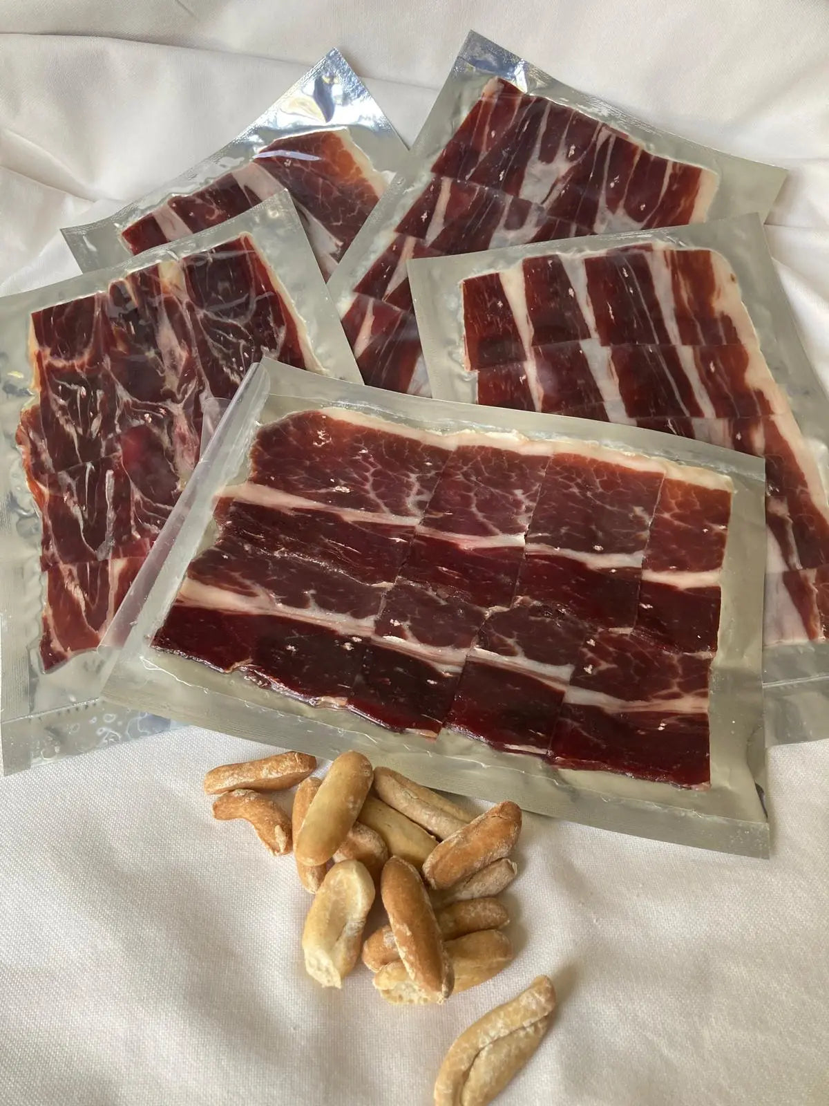 Cinco sobres de jamón loncheado