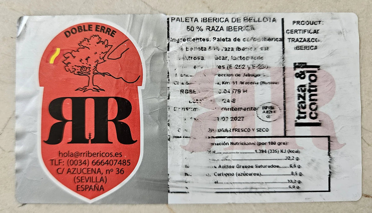 Etiqueta de la paleta ibérica de bellota 50% raza ibérica RR Doble Erre: denominación de venta, ingredientes, lote, consumo preferente, registro sanitario, información nutricional y certificación de Traza & Control.